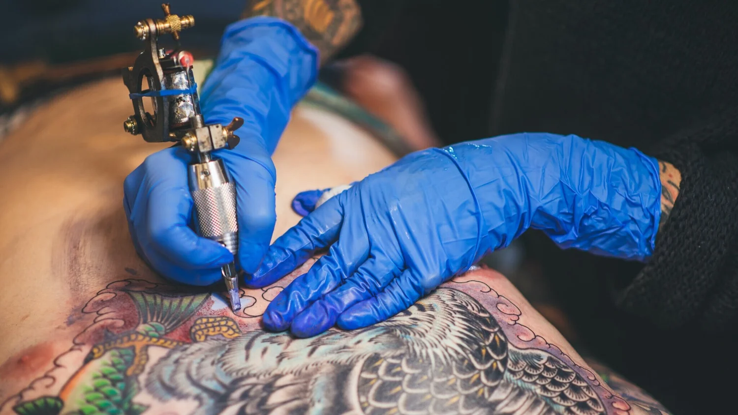 Tattoo artist at work — traditional craft